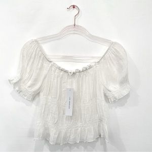 Not extremely white, more of an off white cream white.